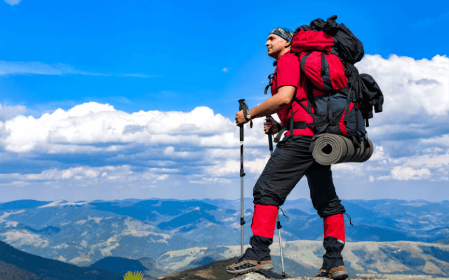 Hiker wearing bandana enjoying the view of nature