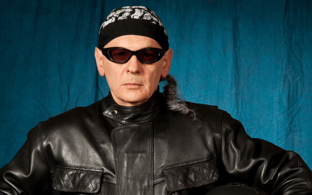 Mature man wearing leather jacket, sunglasses and a doo rag