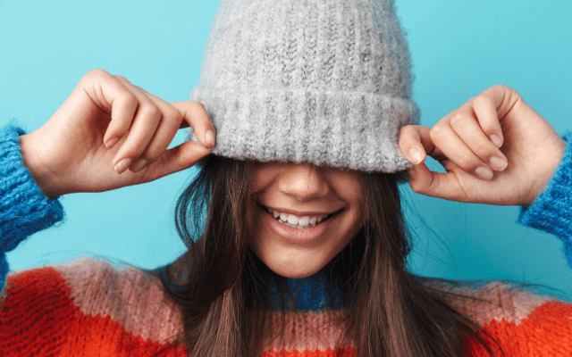 A smiling girl wearing a beanie cap