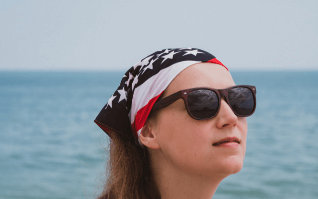 Girl in sunglasses and American flag bandana