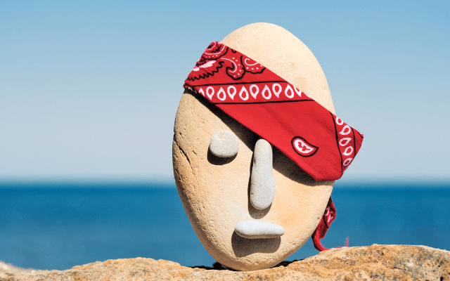 Stone head with red paisley bandana